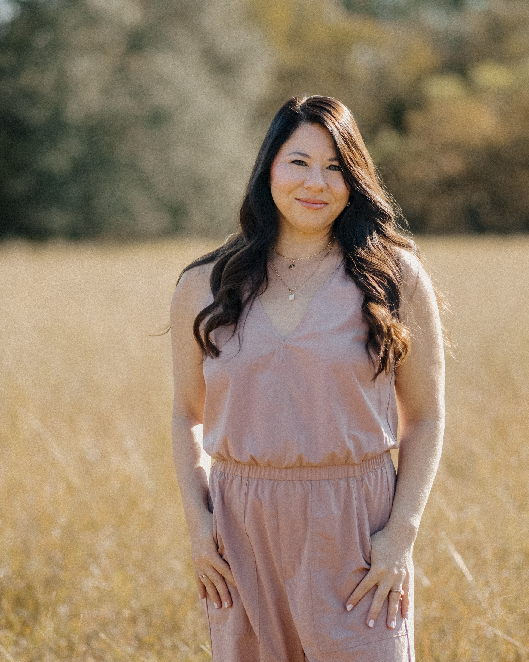 Desiree de Lunae standing in a sunlit field
