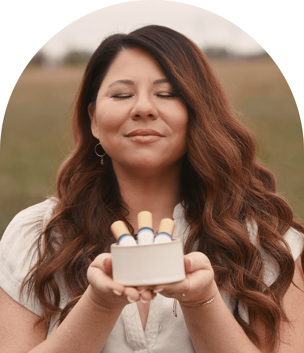 Desiree de Lunae holding essential oil blends
